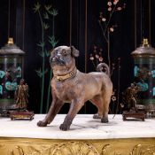 AN EARLY 20TH CENTURY AUSTRIAN PAINTED TERRACOTTA MODEL OF A PUG