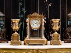 A LATE 19TH / EARLY 20TH CENTURY FRENCH CHAMPLEVE ENAMEL CLOCK GARNITURE
