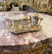 A MINIATURE LIMOGES PORCELAIN COFFEE SET OF NAPOLEONIC DESIGN