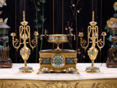 BARBEDIENNE: A LATE 19TH CENTURY CHAMPLEVE ENAMEL AND ORMOLU CLOCK GARNTURE