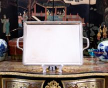 A STERLING SILVER SERVING TRAY IN THE 18TH CENTURY STYLE