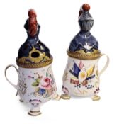 A RARE PAIR OF 18TH CENTURY BILSTON ENAMEL MUSTARD POTS MODELLED AS KNIGHTS