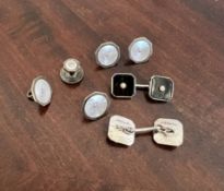 A SET OF FOUR SILVER AND MOTHER OF PEARL SHIRT STUDS AND A PAIR OF CUFFLINKS