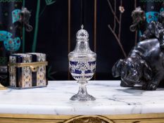 A 19TH CENTURY CONTINENTAL SILVER AND GLASS SUGAR CASTER