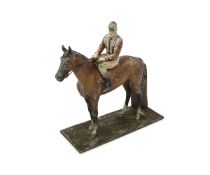 AN EARLY 20TH CENTURY COLD PAINTED SPELTER MODEL OF A JOCKEY AND RACE HORSE