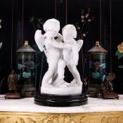 A 19TH CENTURY ITALIAN MARBLE FIGURAL GROUP OF TWO CHERUBS AFTER FALCONET (1716-1791)
