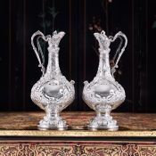 AN IMPRESSIVE PAIR OF IRISH STERLING SILVER 'ARMADA' CLARET JUGS C. 1876-1877, DUBLIN