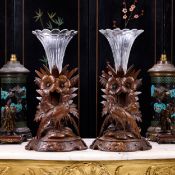 A PAIR OF LATE 19TH CENTURY BLACK FOREST CARVED WOOD VASES