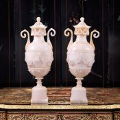 A LARGE PAIR OF ITALIAN 19TH CENTURY CARVED ALABASTER URNS AND COVERS