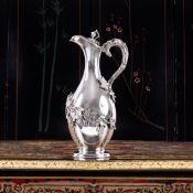 A 19TH CENTURY STERLING SILVER CLARET JUG