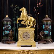 AN EARLY 19TH CENTURY FRENCH GILT BRONZE MANTEL CLOCK WITH MARLEY HORSE