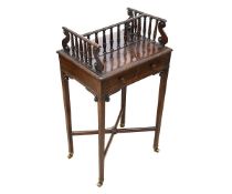 A 19TH CENTURY ROSEWOOD DOUBLE SIDED BOOK CARRIER ON STAND IN THE MANNER OF GILLOWS