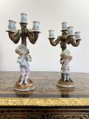 A PAIR OF EARLY 20TH CENTURY DRESDEN PORCELAIN FIGURAL CANDELABRA