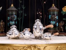 GEORG JENSEN: A RARE STERLING SILVER BLOSSOM PATTERN TEA AND COFFEE SET