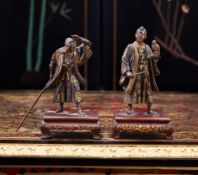A FINE PAIR OF 19TH CENTURY JAPANESE MIYAO BRONZE AND GILT OKIMONOS