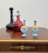 FOUR VARIOUS GLASS DECANTERS