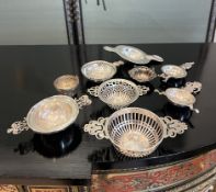 FOUR ENGLISH STERLING SILVER TEA STRAINERS AND OTHER ITEMS