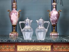 A PAIR OF 19TH CENTURY FRENCH SILVER AND GLASS CLARET JUGS