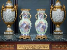A PAIR OF 18TH CENTURY CHINESE PORCELAIN VASES WITH FRENCH ORMOLU MOUNTS