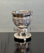A SILVER SALT DECORATED WITH ELEPHANTS
