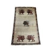 A PERSIAN RUG DEPICTING THE CREST OF THE PERSIAN KING SHAH PAHLAVI