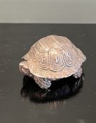 A STERLING SILVER PILL BOX MODELLED AS A TORTOISE