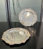 A PAIR OF ROCOCO STYLE SILVER COLOURED METAL DISHES