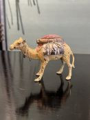 A LATE 19TH / EARLY 20TH CENTURY COLD PAINTED BRONZE PIN CUSHION IN THE FORM OF A CAMEL