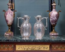 A FINE PAIR OF 19TH CENTURY STERLING SIVLER AND ETCHED GLASS CLARET JUGS C. 1878