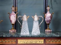 A PAIR OF STERLING SILVER MOUNTED GLASS CLARET JUGS