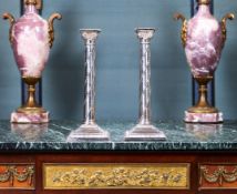 A PAIR OF 19TH CENTURY STERLING SILVER CANDLESTICKS