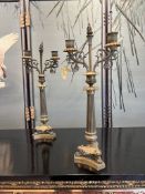 A PAIR OF EARLY 19TH CENTURY FRENCH EMPIRE GILT AND PATINATED BRONZE CANDELABRA
