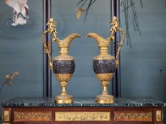 A LARGE PAIR OF 19TH CENTURY FRENCH GILT AND PATINATED BRONZE EWERS AFTER CLODION