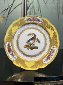 A 19TH CENTURY PARIS PORCELAIN PLATE DECORATED WITH A BIRD