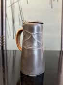 ARCHIBALD KNOX FOR LIBERTY & CO.: AN ARTS AND CRAFTS TUDRIC PEWTER JUG NO. 0278