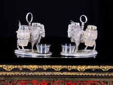A PAIR OF VICTORIAN CRUET SETS MODELLED WITH GOATS