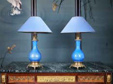 A PAIR OF LATE 19TH CENTURY FRENCH BLUE GLAZED OIL LAMPS CONVERTED TO LAMPS