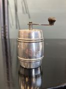 A STERLING SILVER PEPPER GRINDER IN THE FORM OF A BARREL