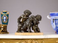A 19TH CENTURY FRENCH BRONZE GROUP OF CHERUBS AFTER CLODION