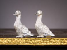 A PAIR OF STERLING SILVER DUCK SALT AND PEPPER POTS BY WILLIAM COMYNS, LONDON