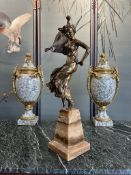 A GILT BRONZE AND ONYX FIGURE OF A DANCING GIRL