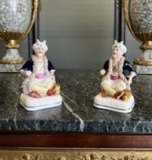 A PAIR OF 19TH CENTURY GLAZED POTTERY FIGURES OF TURKS