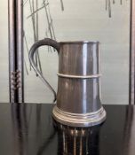 AN 18TH / 19TH CENTURY IRISH PEWTER MUG WITH CREST