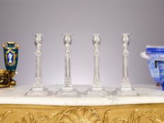 A SET OF FOUR EARLY 20TH CENTURY STERLING SILVER CANDLESTICKS, LONDON 1917