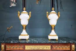 A LARGE PAIR OF LOUIS XVI STYLE WHITE MARBLE AND GILT BRONZE URNS