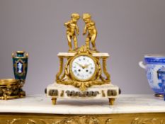 A 19TH CENTURY FRENCH ORMOLU AND MARBLE CLOCK BY RAINGO FRERES, PARIS