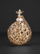 AN 18TH CENTURY GOLD AND ENAMEL SCENT BOTTLE OF ROCOCO DESIGN