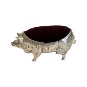A PIN CUSHION MODELLED AS A PIG