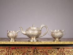 AN EARLY 20TH CENTURY ANGLO-INDIAN SILVER TEA SET BY TARACHAND PURSRAM RAMSWAM C. 1920