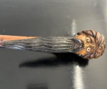 A LATE 19TH / EARLY 20TH CENTURY CANE WITH OTTOMAN HEAD HANDLE